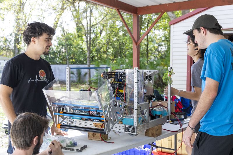 Team 79 Krunch students building their competition robot during build season