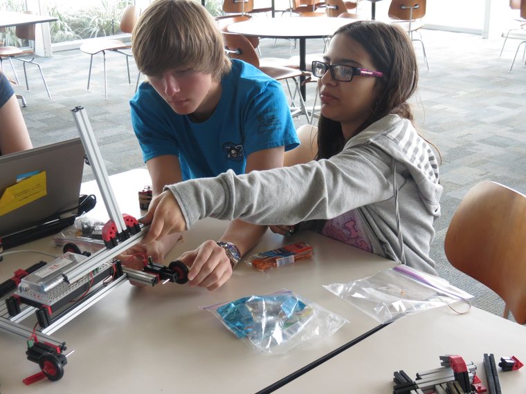 Krunch students mentoring young makers on a hands-on build