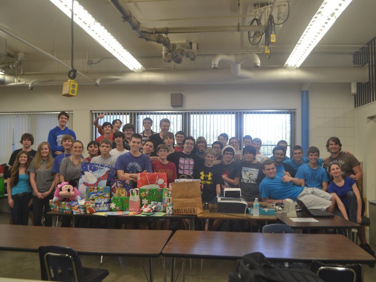 Team 79 Krunch with collected gifts for a holiday community service drive