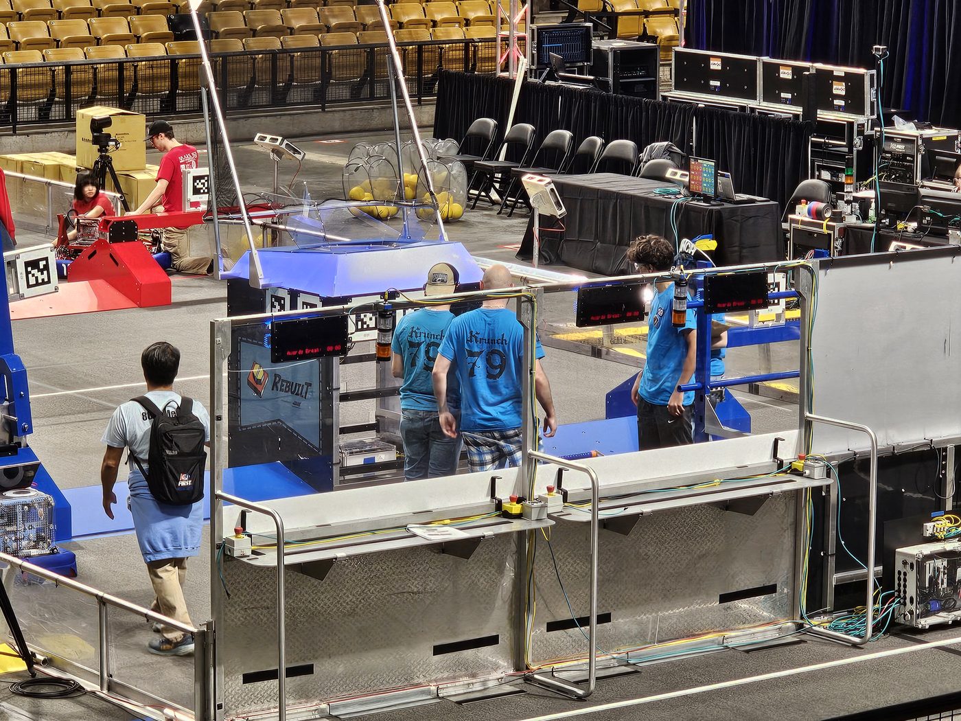 Team 79 Krunch working on their robot in the competition pit