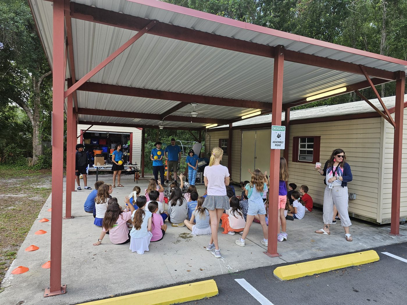 Team 79 Krunch demonstrating their robot to a crowd of elementary students at Cypress Woods Elementary