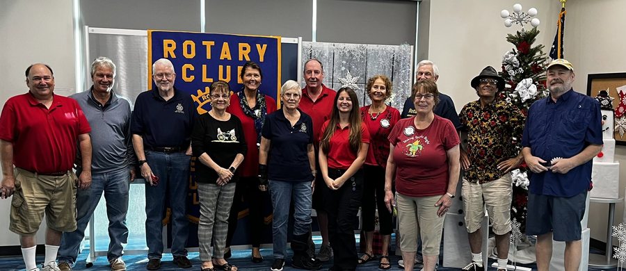 Members of the Rotary Club of East Lake Sunrise standing together at a holiday meeting