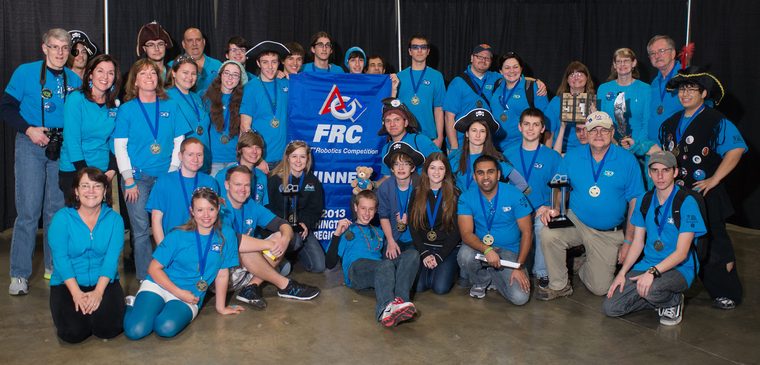 Team 79 Krunch holding the Regional Winner banner and trophy at the 2013 Washington DC Regional