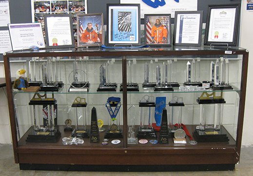 Team 79 Krunch's trophy case filled with FIRST Robotics Competition awards